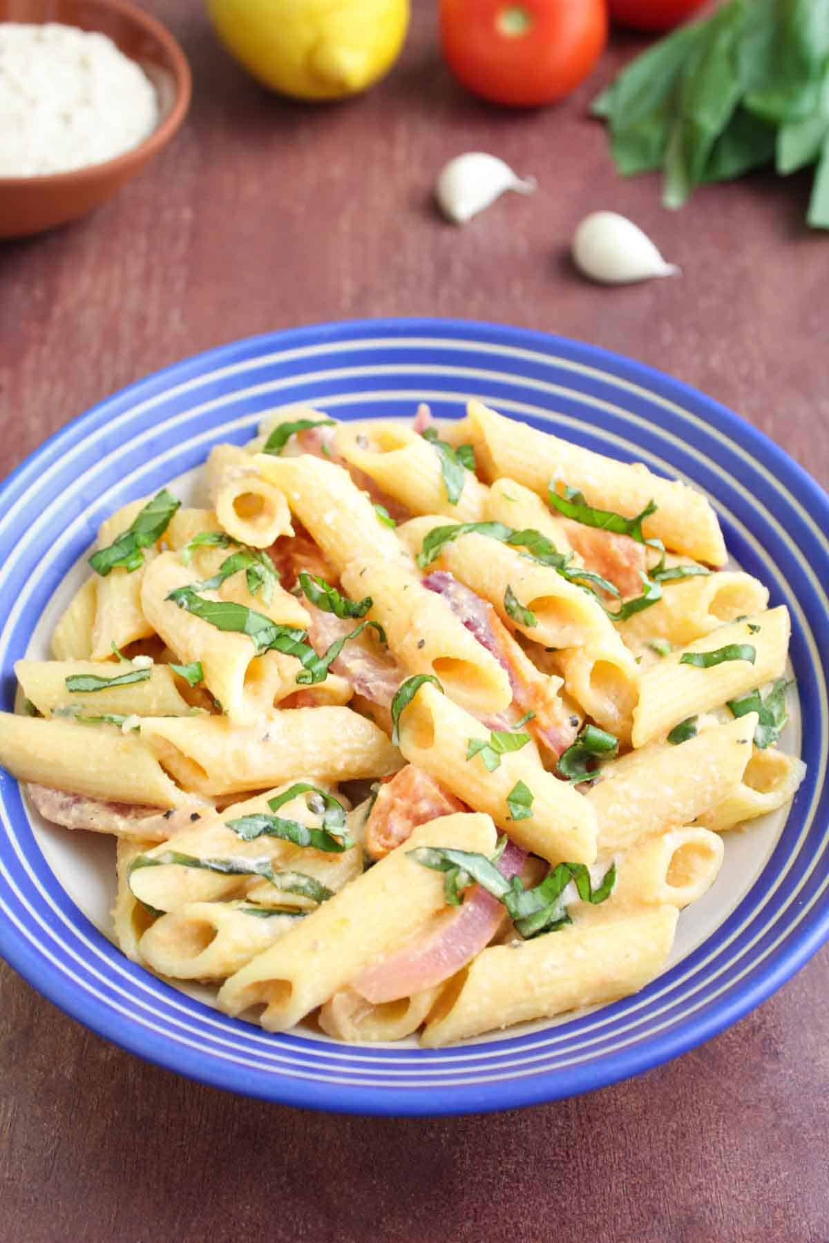 Hummus Pasta in Bowl with Fresh Basil