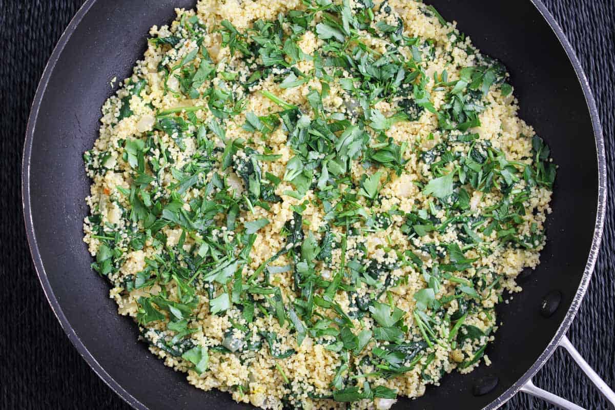 Recipe Process Shot - Adding Fresh Parsley to Spinach Couscous Dish