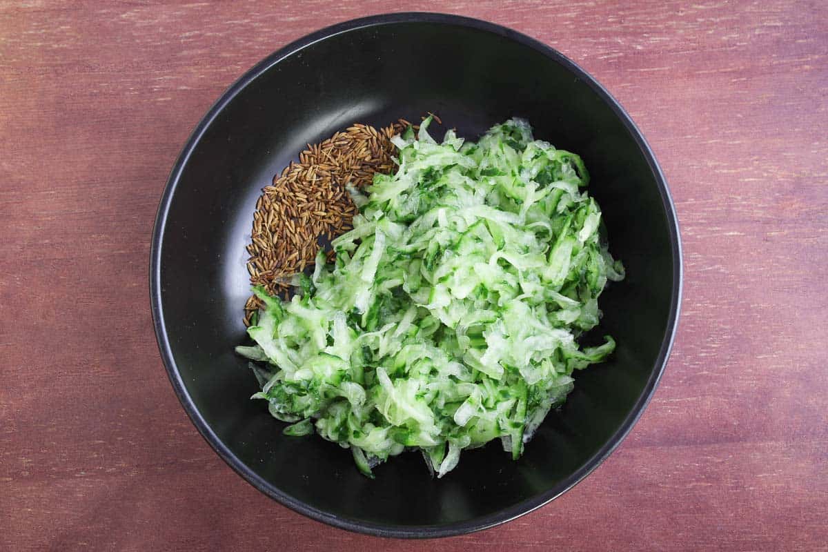 Toasted Cumin Seeds and Grated Cucumber in Bowl