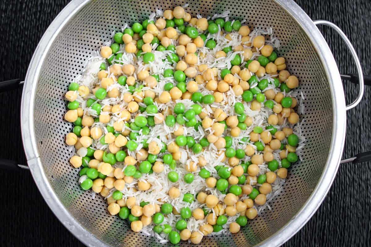 Cooking Process - Rinsing Basmati Rice, Chickpeas, and Green Peas in Colander