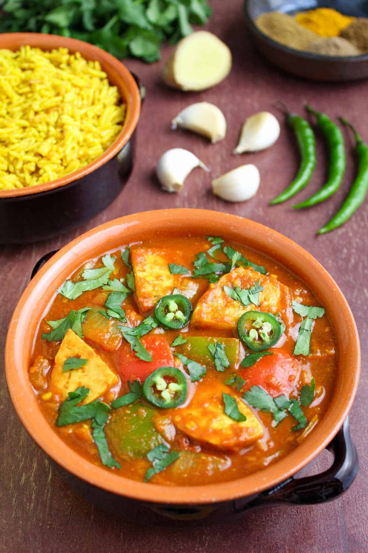 Tofu curry in bowl with pilau rice.