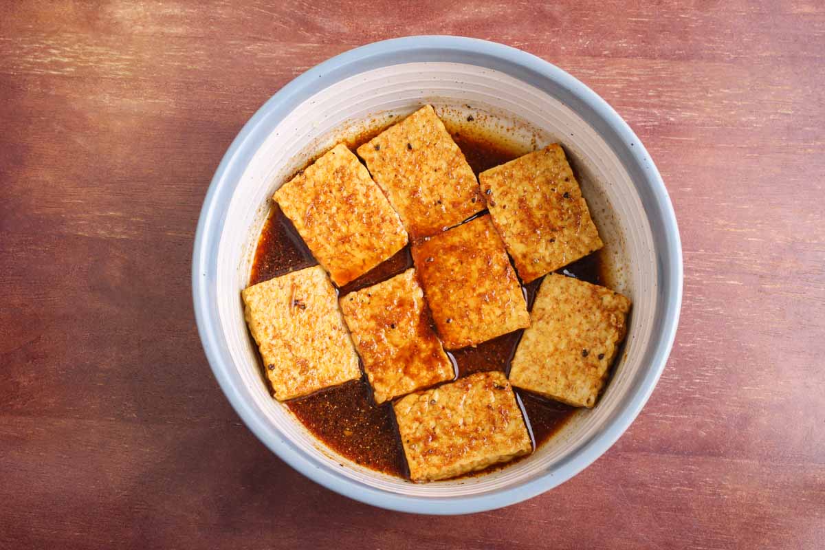 Recipe Process Shot – Marinating Tempeh Pieces Before Grilling
