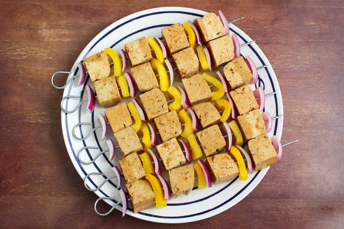 Recipe Process Shot – Adding Tofu and Veg to Skewer Sticks