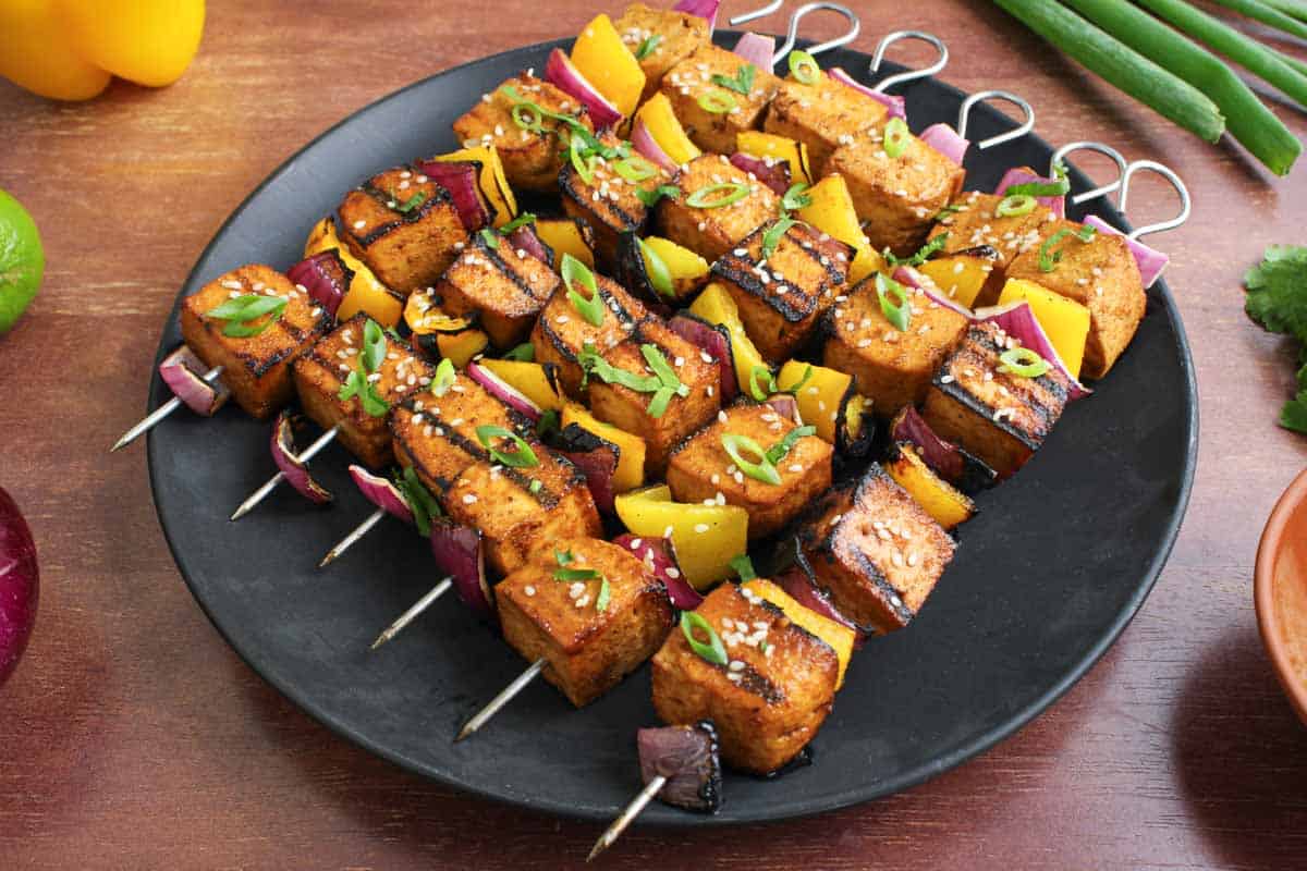 Asian-Inspired Tofu Skewers Served with Sesame Seeds and Coriander