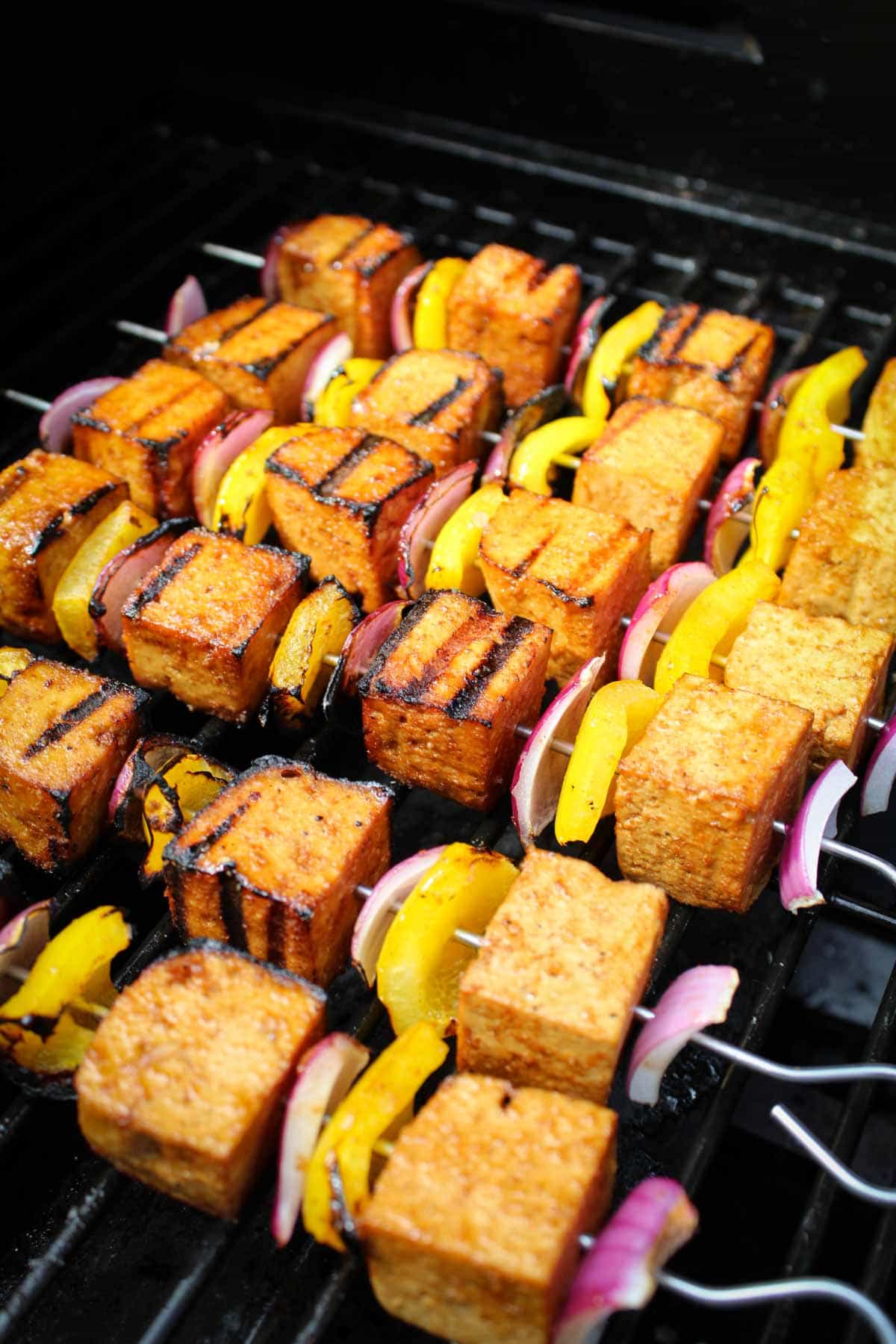 Recipe Process Shot – Meat-Free Kebabs Cooking on Barbecue