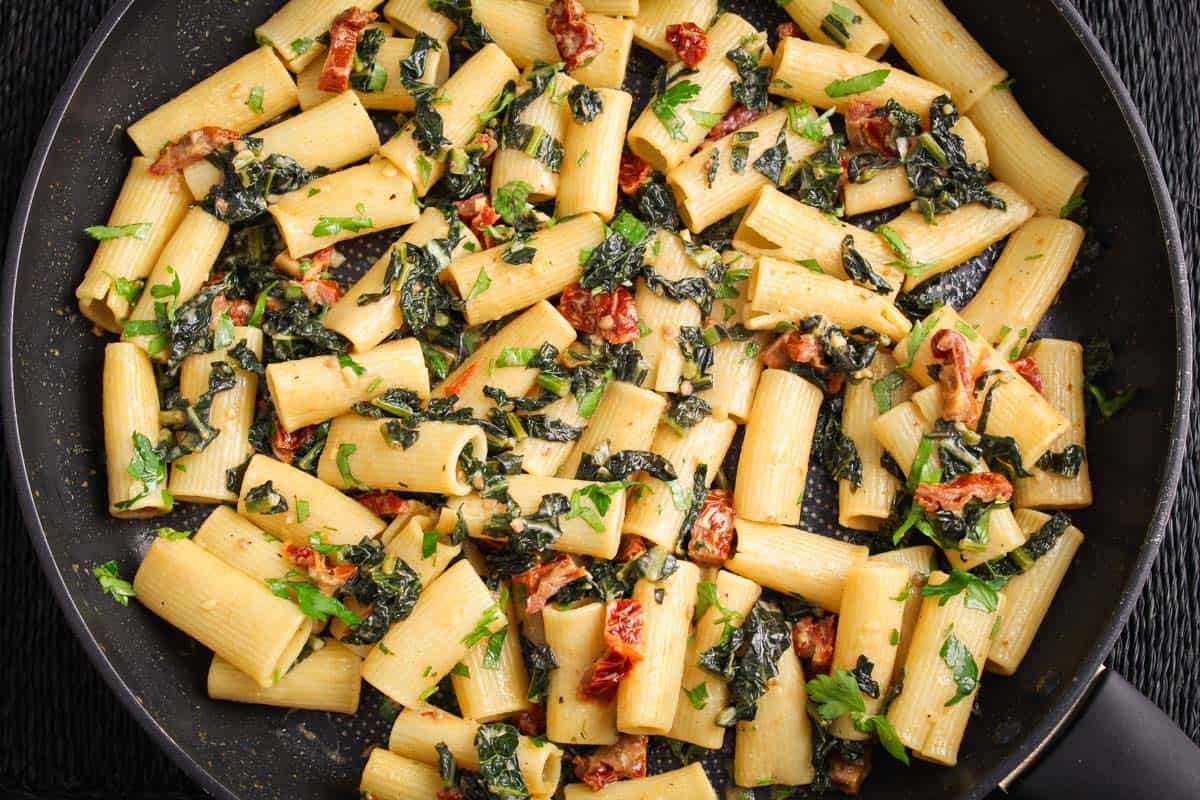 Recipe Process Shot – Cooked Tomato Kale Pasta in Pan