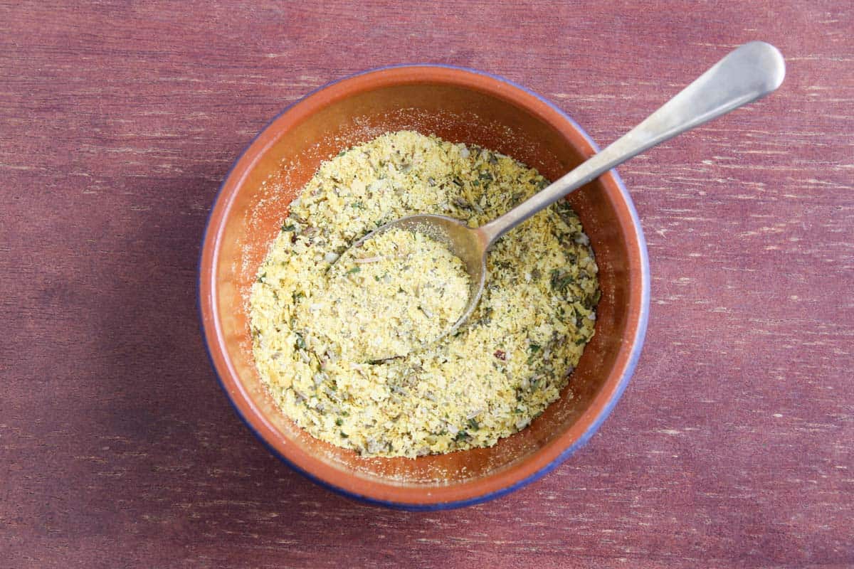 Recipe Process Shot – Preparing Cheesy Herb Coating in Bowl