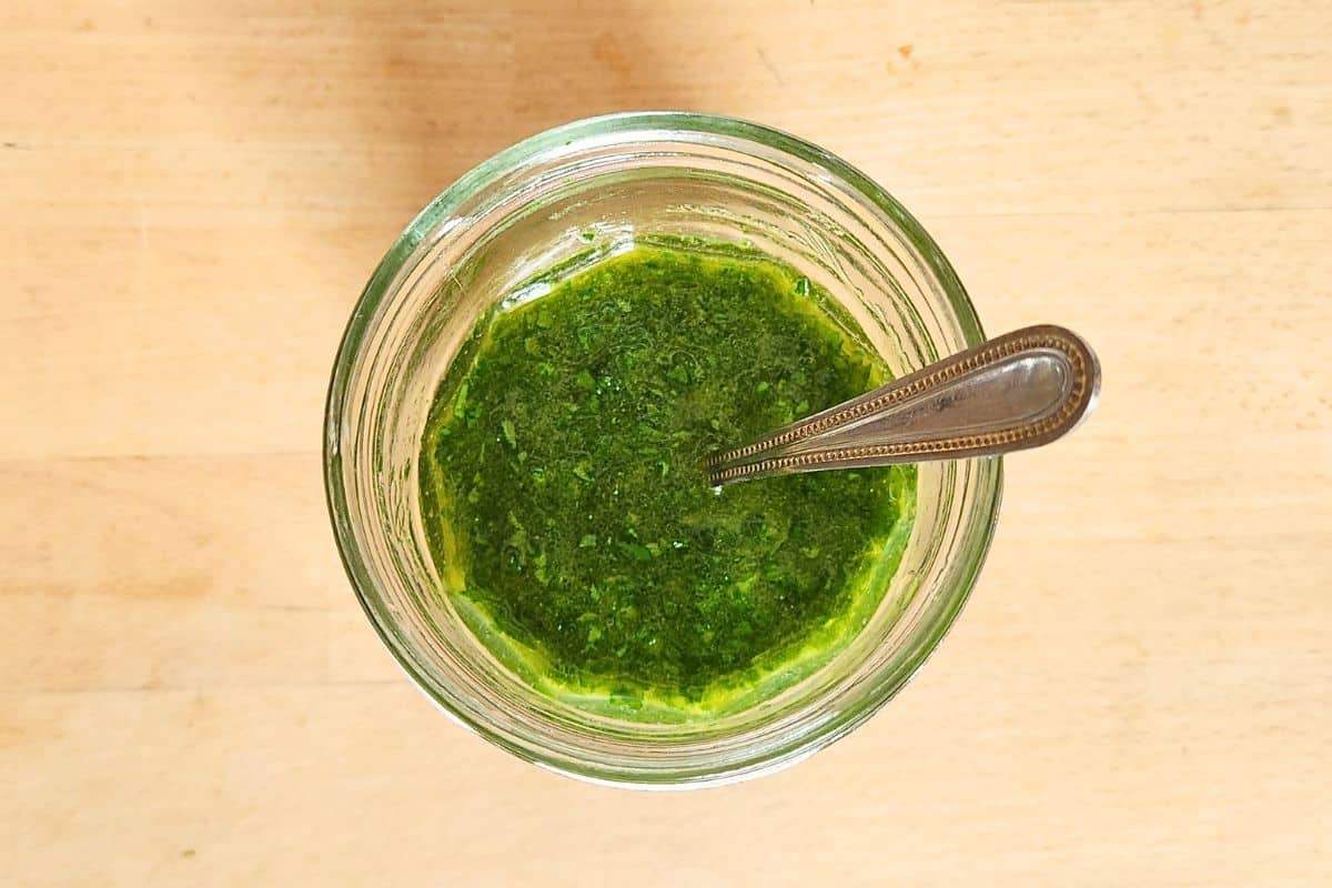 Wild garlic salad dressing overhead with spoon