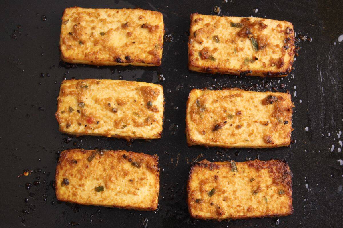 Crispy miso baked tofu slices on baking sheet