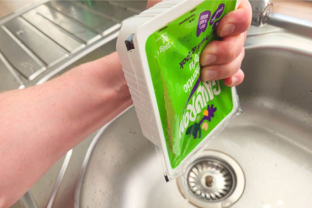 Draining water from tofu pack before freezing