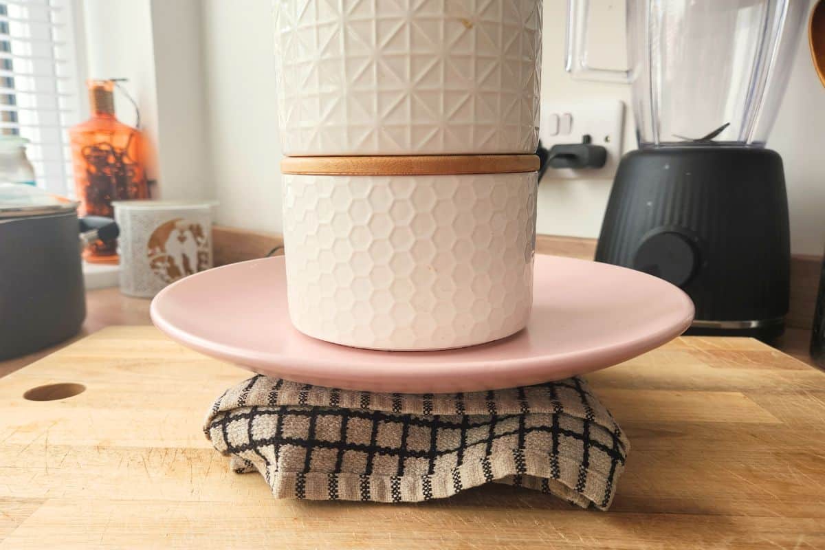 Pressing tofu with plate and weight on top