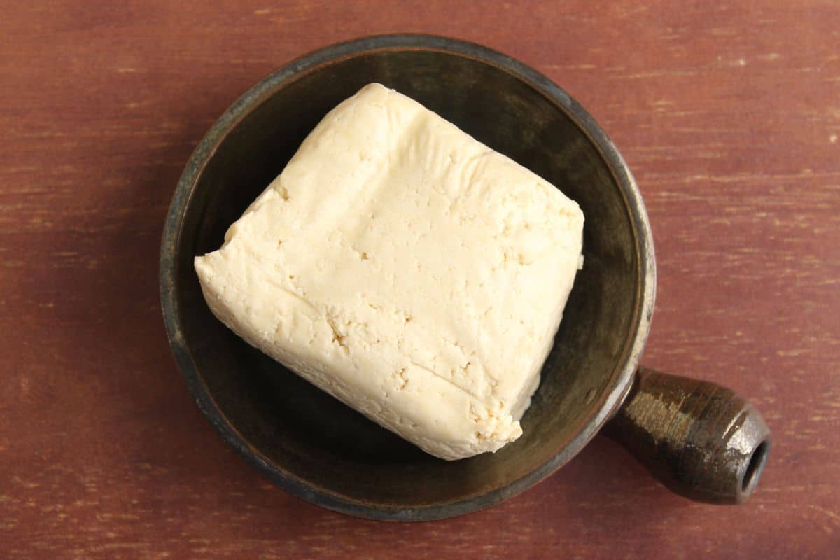 Block of extra-firm tofu in bowl