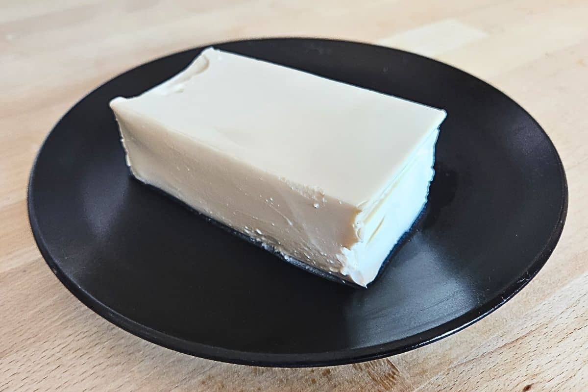 Yutaka silken tofu block drained on black plate
