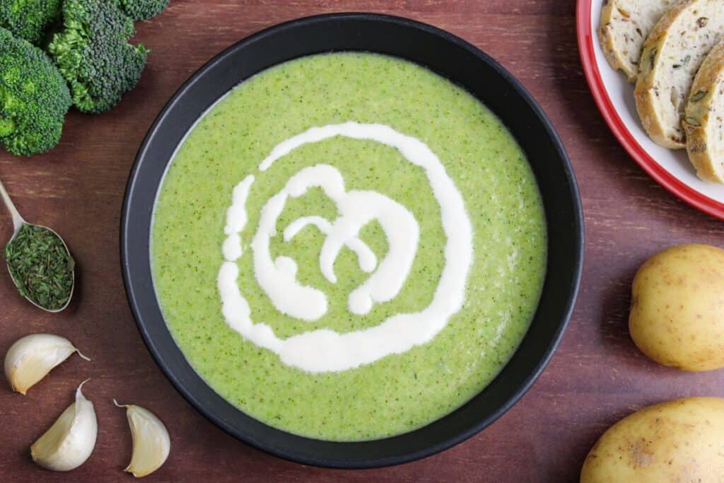 Vegan broccoli and potato soup in bowl overhead