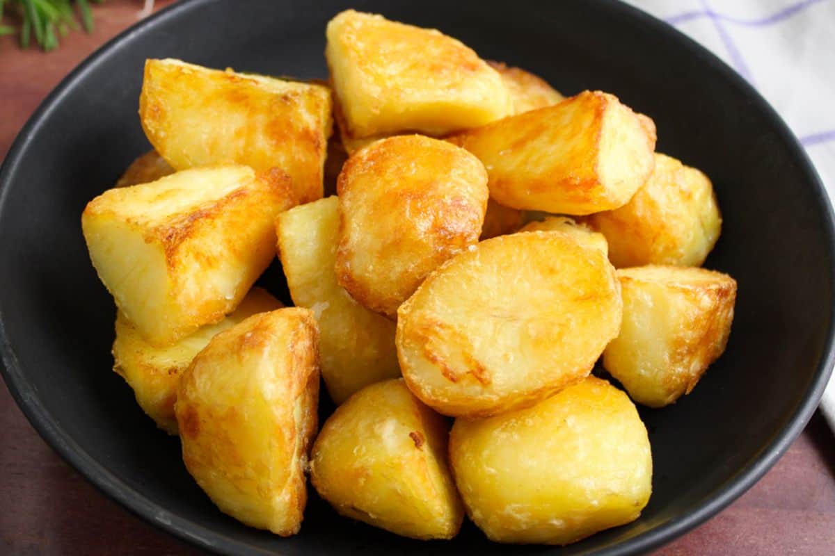 Crispy vegan roast potatoes in bowl