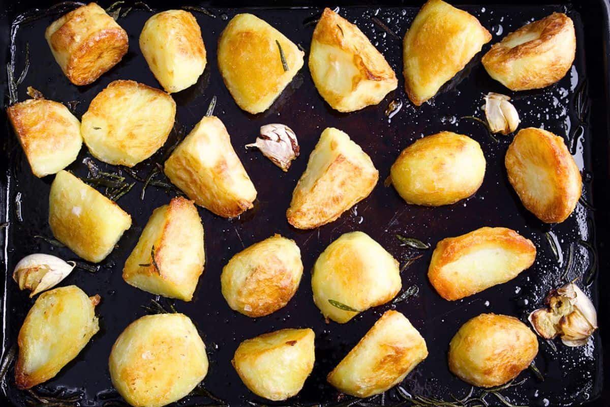 Golden roast potatoes on baking sheet