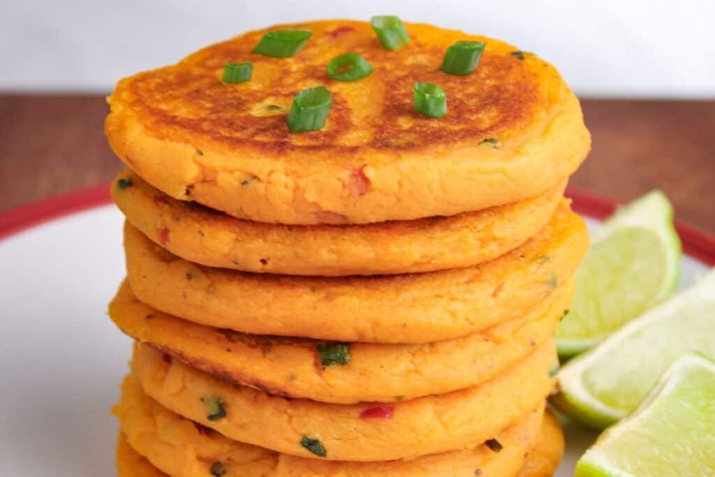 Stack of vegan sweet potato pancakes on plate