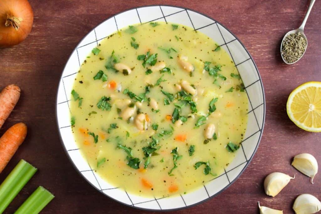 Vegan white bean and potato soup in bowl overhead