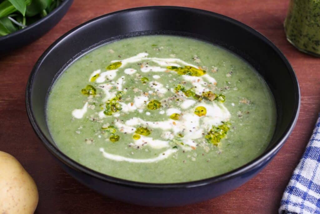 Vegan wild garlic and potato soup in bowl